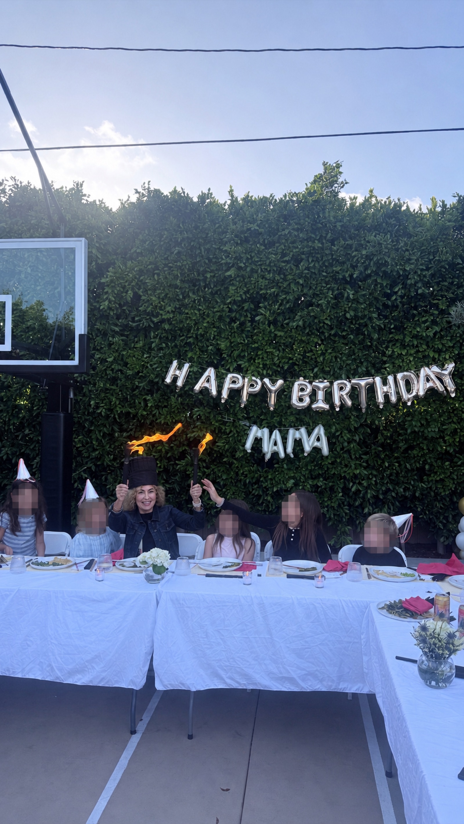 Birthday guest enjoying a backyard hibachi fire moment